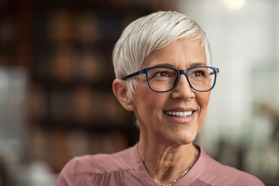 mature woman smiling while looking to the side